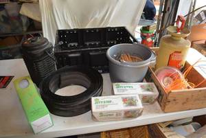 lot 121 image: Garden Sprayer, Weed Eater Coils, Wind Chime, Landscape Edge