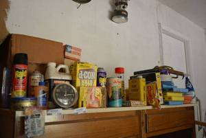 lot 139 image: Garage Lot Contents on Top of Cabinet, Rat Poison, Nails, Paint Thinner