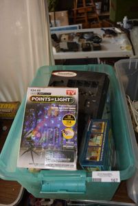 lot 167 image: Christmas Light Show Projector, Can Lights and Battery Charger (BIN NOT INCLUDED BRING BOXES)