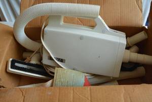 lot 56 image: Buster B. Oreck Hand Vacuum and Attachments