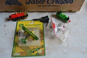 lot 67 image: John Deere Replica Plane in Packaging, Air Force Jet, Trains and Red Baron Replicas