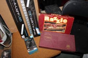 lot 209 image: Scrabble and Razzle Games, 2 LED Lamps, Outdoor Plug and Metal Ruler