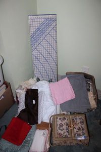 lot 219 image: Sewing Lot Sewing Basket, Fabrics and Pattern Cutting Board