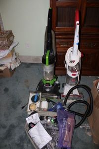lot 228 image: Vacuum Lot Bissell Model 1797, Hoover Floormate, Bissell Steam Mate Plus Misc. Accessories