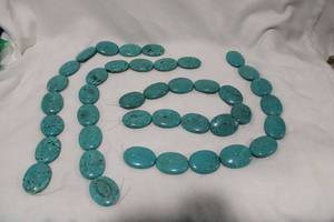 lot 398 image: (4) sets of 10 Turquoise oval cabochon stones. Varying matrix but color matched for jewelry, belts, etc.