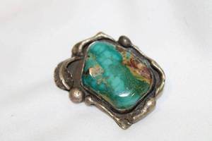 lot 402 image: Sterling silver artisan crafted Green Mohave Turquoise statement ring with bent shaft. No markings. Heavy silver. Unknown size but larger like 9 or 10.