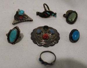 lot 404 image: Sterling silver artisan crafted damaged jewelry. (4) rings, (2) earrings (both marked 925) and collar point with Turquoise, coral.