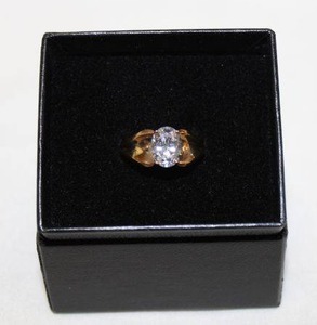 lot 413 image: Prong set faceted oval CZ solitaire ring. Stamped 10K P (10K PLUMB). Size 8.5  in box. Did not test gold - please preview.