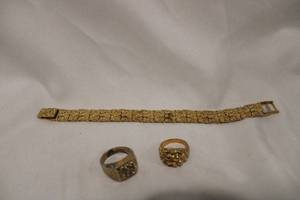 lot 421 image: Gold nugget style jewelry. Includes 9L bracelet with fold over claps, matching ring (Size 8) and  complimentary 18K HE ring with simulated diamonds (some finish loss to inside of band, Size 12)