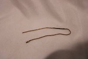 lot 423 image: 14K yellow gold braceletchain section. Marked 14K on end. 7L