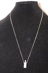 lot 437 image: Sterling silver perfume bottle pendant necklace. Unmarked. 24L. Perfume bottle has screw top with dauber insert.