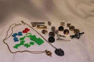 lot 439 image: Cuff link, tie bar and tie tack selection. Also includes plastic figures and pewter lion necklace plus