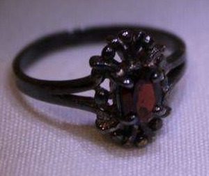 lot 447 image: Sterling silver filigree Garnet ring. Marked 925. Size 6. Garnet tested. Approx 1.00 carat
