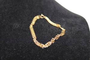 lot 452 image: Thick Sterling silver vermeil (gold over silver) twisted French rope chain bracelet. 8L Lobster clasp. Marked 925 Made in Peru