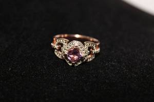 lot 451 image: Sterling silver rose gold vermeil two tone marcasite and prong set Amethyst ring. Marked 925 KJY Size 10. Approx 1.30 carats. Amethyst tested.