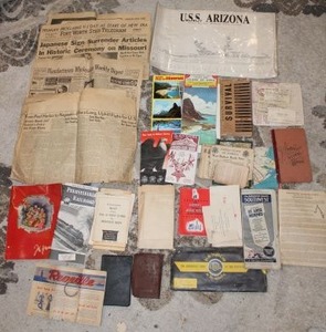 lot 539 image: Large quantity of WWII war memorabilia, Japanese surrender, USS Arizona detail, catalogs, maps GI information, war ration booklets, and more see pics