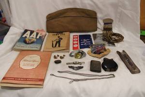 lot 540 image: WWII GI material Air Force Material and more, Cuff links, lighters, clips manuals, PinUp card and more