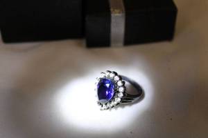 lot 543 image: Patinated Sterling silver synthetic prong set sapphire and diamond simulant ring. Marked 925. Size 6. Pear shape gem approx. 3.50-4.00 carats.