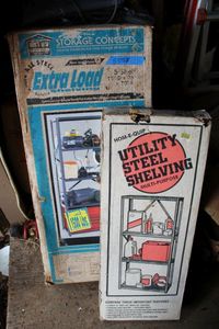 lot 555 image: Steel Shelving Units One 4 Shelf 12 x 30 x 48 Unit and One 5 Shelf 15 x 36 x 70 (Still in Boxes)