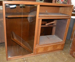 lot 87 image: Entertainment Cabinet with Glass Front Doors and Side Roll Doors