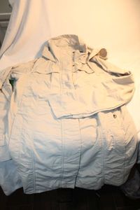 lot 352 image: Eddie Bauer womens rain jacket Size Medium. Deep side zippered pockets, hooded w cowl neck. Fitted pull ties on back. All zippers and snaps work. No condition issues. Looks better in person.