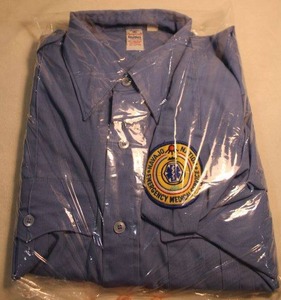 lot 357 image: Navajo Nation Emergency Medical Services patch on a 16.534 Large poplin shirt w epaulets (Selling for patch collection only)