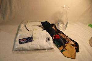 lot 320 image: RARE PGA Crystal decanter and PGA TOUR Bright White Pullover Large NWT Crisp White and Blue with ribbed collar, blue logo. Collar Stripe and assorted 100% silk golf theme ties