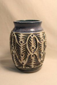 lot 334 image: 2016 Rachel artisan crafted kiln fired thrown pottery vase featuring incised and textured vertical 3D bas relief fish with blue glaze ground 6H