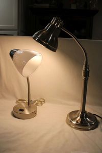 lot 386 image: (2)  desk lamps. One stainless steel, one with charging port. Both work