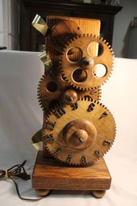 lot 313 image: Clockworks INC 1985 solid Oak gear (steampunk) clock. Needs rewired and one gear reattached. Serial No 2554. RARE
