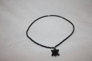 lot 367 image: Polished Hematite bead necklace with Hematite pendant in turtle form. 17L and turtle pendant is 1L