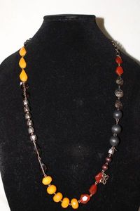 lot 368 image: Signed Fossil faux butterscotch amber glass bead and patinated metal bead necklace w heart, lock and key, crystal cross dangles. Marked Fossil on oversized clasp and  heart charm. 30L