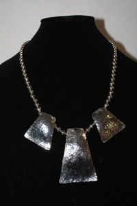 lot 372 image: Sterling Silver  Graduated ball bead necklace w 3 hammered fixed station pendants with bales. No markings. Shepherd crook clasp. 22L  Probably from Mexico