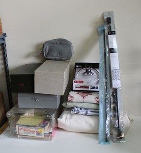 lot 77 image: Index Card Boxes, Gray Metal Box, Clear Storage Box with Coloring Books, Delta Hand Towel Holder, Shower Curtain, Fabric and Curtain Rods