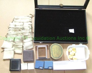 lot 64 image: Assorted jewelry boxes. pouches, and counter top display case