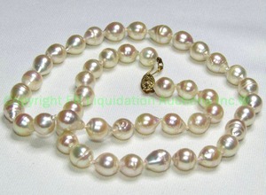 lot 59 image: 14K yellow gold and ringed pearl strand. 17L Clasp marked 14K.