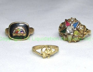 lot 157 image: (2) 10K Fraternal Order rings. (1) multi gemstone (Ruby, sapphire, plus) and diamond (approx .50 cttw). Size 7. includes 10K enamel and Black Onyx Fraternal ring. marked 10K. includes a gold tone figural horse ring. Size 3.5