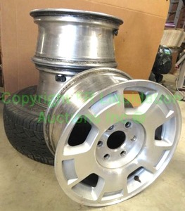 lot 198 image: Matching Aluminum rims 3 count and tire with rim