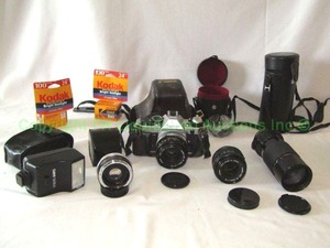 lot 311 image: Canon 35mm camera plus extra lenses and accessories as shown