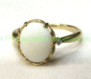 lot 314 image: 10K yellow gold white Opal and Diamond ring. Marked 10K. Size 7.25