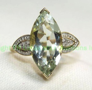 lot 324 image: 10K yellow gold Aquamarine and Diamond ring. Features a filigree high table with approx. 4.0 carat marquise shape gem and diamond shoulders. Marked 10K. Size 8