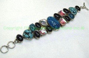 lot 326 image: Sterling silver Turquoise and multi gemstone bracelet. Toggle clasp. Marked 925. Includes Turquoise, Black Onyx, Faceted quartz and blue crackle quartz