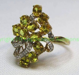 lot 20 image: 10K yellow gold, Yellow Sapphire and diamond cluster ring. Marked 10K. Size 7