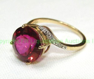 lot 21 image: 10K yellow gold, Ruby and diamond ring. Marked 10K and ATR. Size 8.5