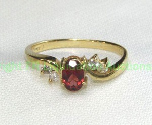 lot 22 image: 14K yellow gold Garnet and Diamond ring. Marked 14K CAM Size 7.5