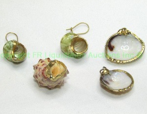 lot 96 image: (4) Natural shell jewelry. Includes a pair of earrings and 3 pendants. All have 24K liquid gold accents.