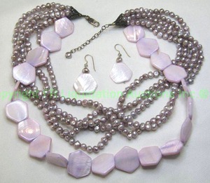 lot 97 image: Sterling silver demi parure set. Includes a multi strand glass faux pearl necklace and earrings. 18L