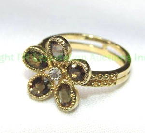 lot 99 image: 10K yellow gold and Spinel ring in flower form. Marked 10K. Size 7.5