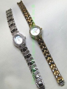 lot 100 image: (2) Croton watch duo. Gold and silver two tone with Mother Of Pearl Face (Model CR207536) and white metal with diamond markers (Model CN207125).