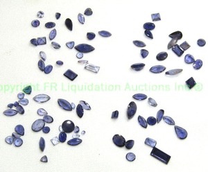 lot 102 image: (4) packages of mixed Iolite gems. Each 1 carat10 cttw per bag.